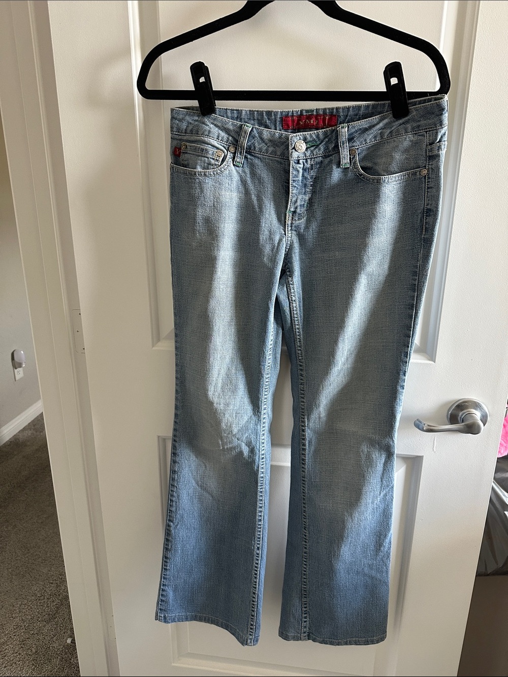Light Blue Flared Jeans with Subtle Fade - Women's